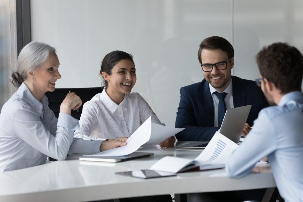A diverse group of professionals collaborating during a meeting.